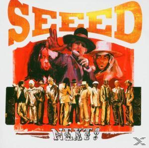 Albumcover: Musiker in einer Gruppe, einige mit Mikrofonen. Text: SEED, NEXT!. Rote und weiße Farben.