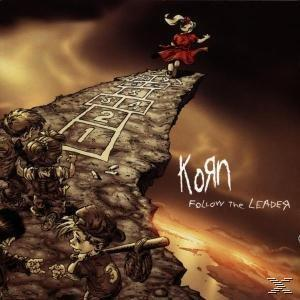 Korn Albumcover. Cartoon von Kindern, die auf einer Klippe Himmel und Hölle spielen. Titel: Follow the Leader.