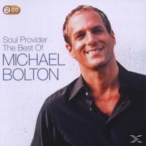Albumcover. Michael Bolton lächelt in einem schwarzen Hemd, lehnt sich leicht zurück. Titel: 'Soul Provider The Best Of'.
