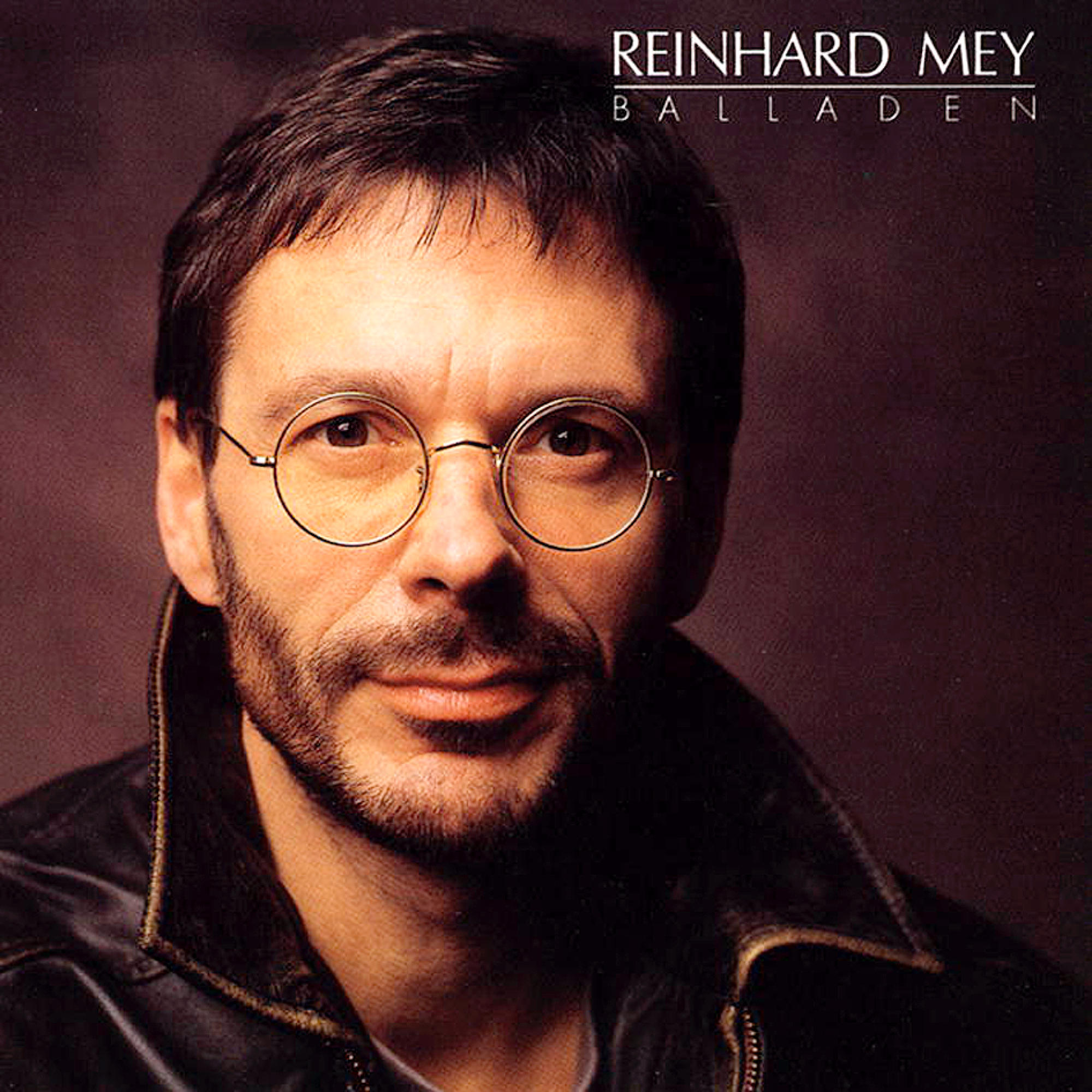 Albumcover mit einem Mann mit Brille, der den Betrachter ansieht. Der Text lautet 'Reinhard Mey, Balladen'.