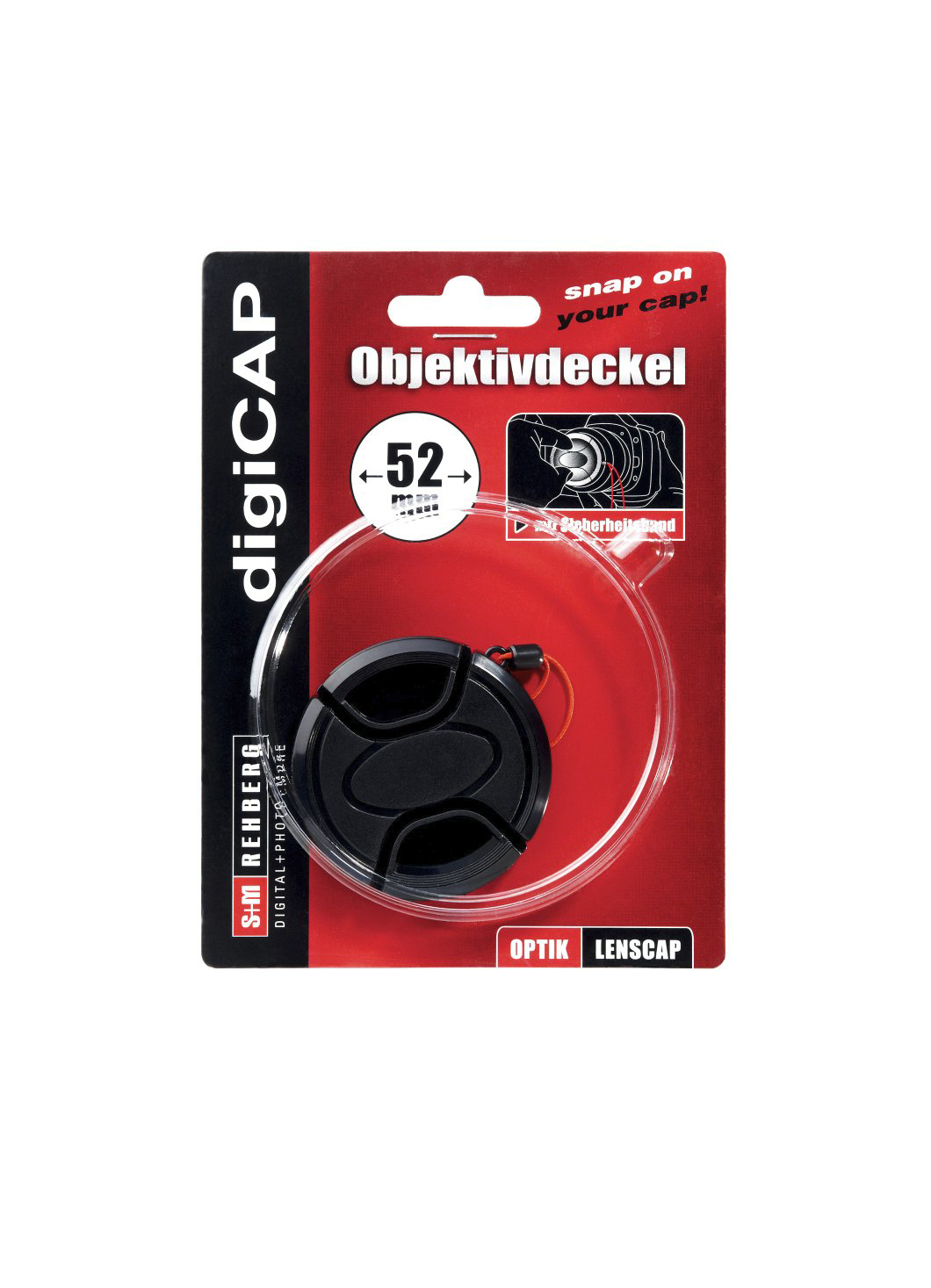 Ein schwarzer Objektivdeckel in einer rot-schwarzen Kartonverpackung.