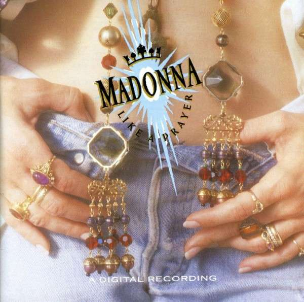 Album borító. Madonna kezei nyakláncokat tartanak. Farmer háttér.