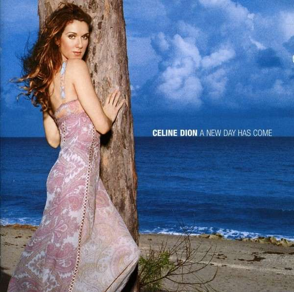 Celine Dion album borító. Egy fa mellett áll, ruhát visel, kék ég és óceán a háttérben.