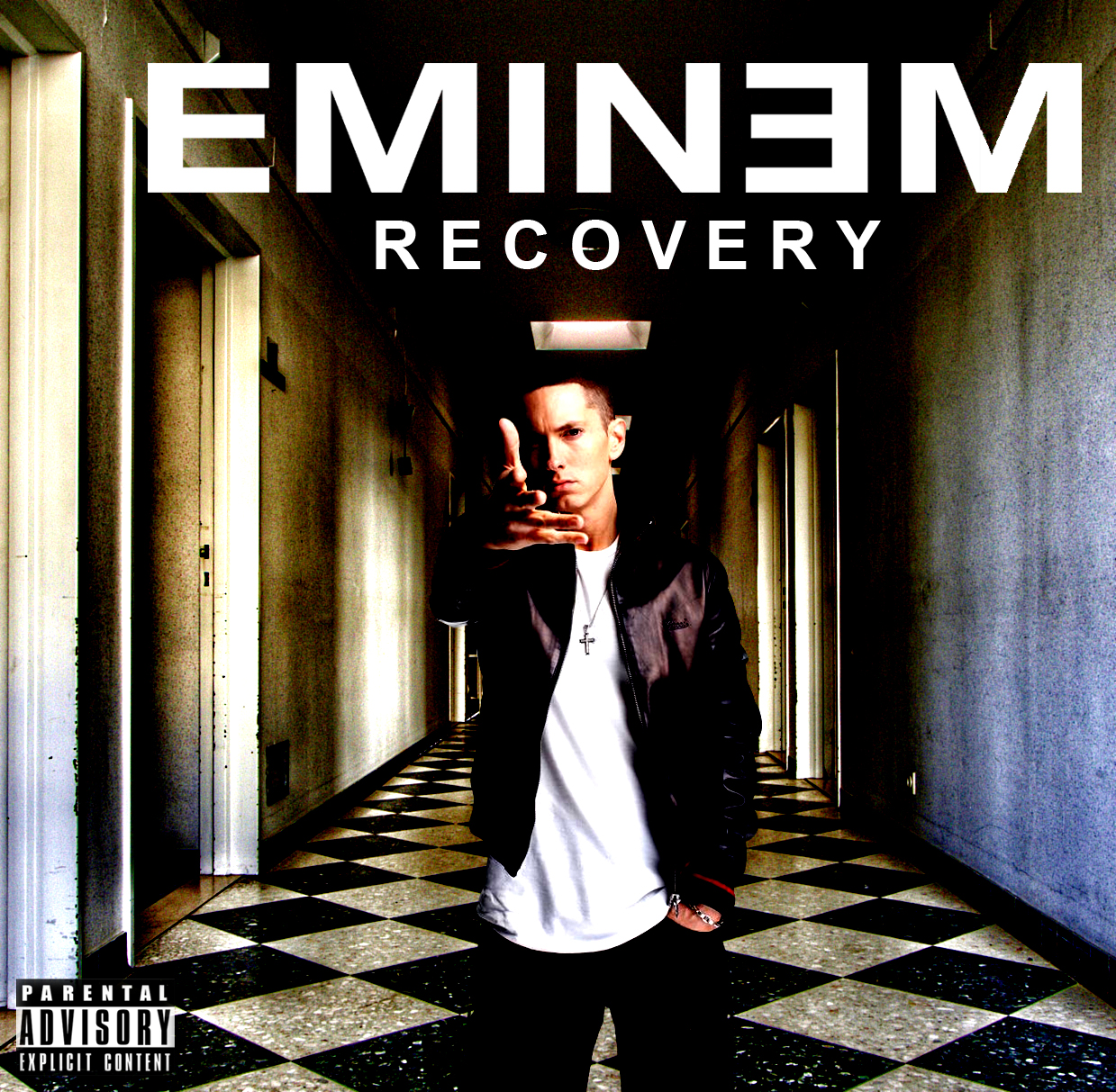 Album borító. Eminem fegyvert fog. Szöveg: Recovery.