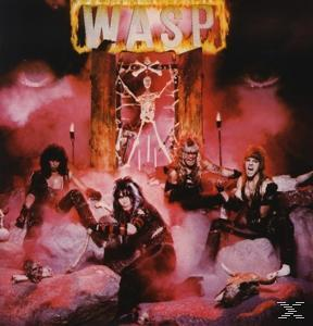 Albumcover der Band WASP mit Bandmitgliedern in einer feurigen Szene mit einem Skelett im Hintergrund.