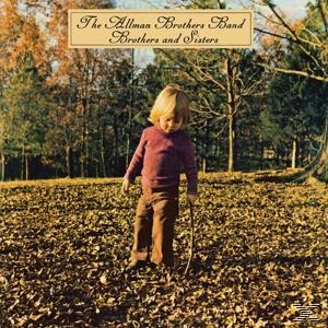 Albumcover mit einem Kind mit einem Stock, das auf einem Feld von Blättern steht.