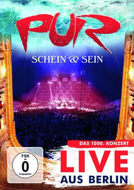 DVD-Cover mit PUR-Band live auf der Bühne, großem Publikum und rotem Logo.