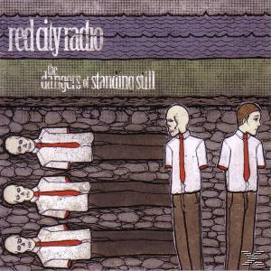 Albumcover mit Bandnamen und Bild von Skeletten und zwei Männern in Anzügen mit Krawatten.