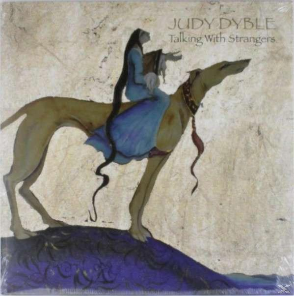 Egy kék ruhás nő lovagol egy kutya hátán világos háttér előtt. Album címe.