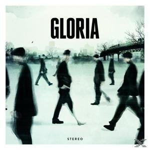 Albumcover: Verschwommen gehende Menschen in einer Stadt, mit dem Wort 'Gloria' in fetten Buchstaben.