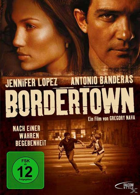 Filmplakat mit Jennifer Lopez und Antonio Banderas. Zwei Personen rennen in einem Gebäude. Der Titel ist BORDER TOWN.