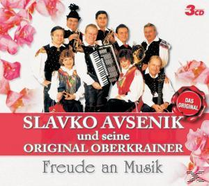 Albumcover mit einer Gruppe von Musikern und Blumen drumherum. Text auf Deutsch.
