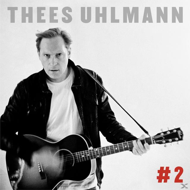 Mann mit Gitarre, schwarze Jacke, weißes Hemd, grauer Hintergrund, Albumcover, Text: Thees Uhlmann.
