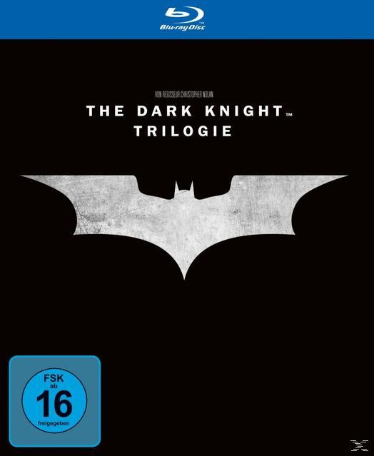 The Dark Knight Trilogie Blu-ray Cover. Batman-Logo auf schwarzem Hintergrund. FSK-Logo unten links.