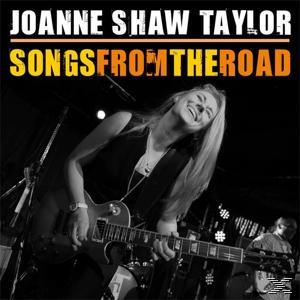 Albumcover: 'Songs From The Road' von Joanne Shaw Taylor. Eine Frau spielt Gitarre lächelnd.