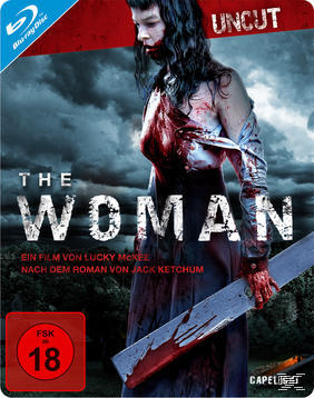 DVD-Cover einer mit Blut bedeckten Frau. Der Titel lautet The Woman, mit einer Altersfreigabe von 18.