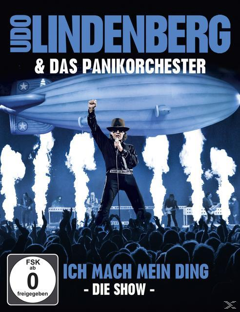 Udo Lindenberg DVD-Cover mit einem Mann auf der Bühne, einem Luftschiff und einer Menge.