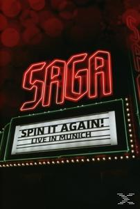 Neonschild mit 'SAGA' über einer Leuchtreklame mit 'Spin it Again! Live in Munich'.