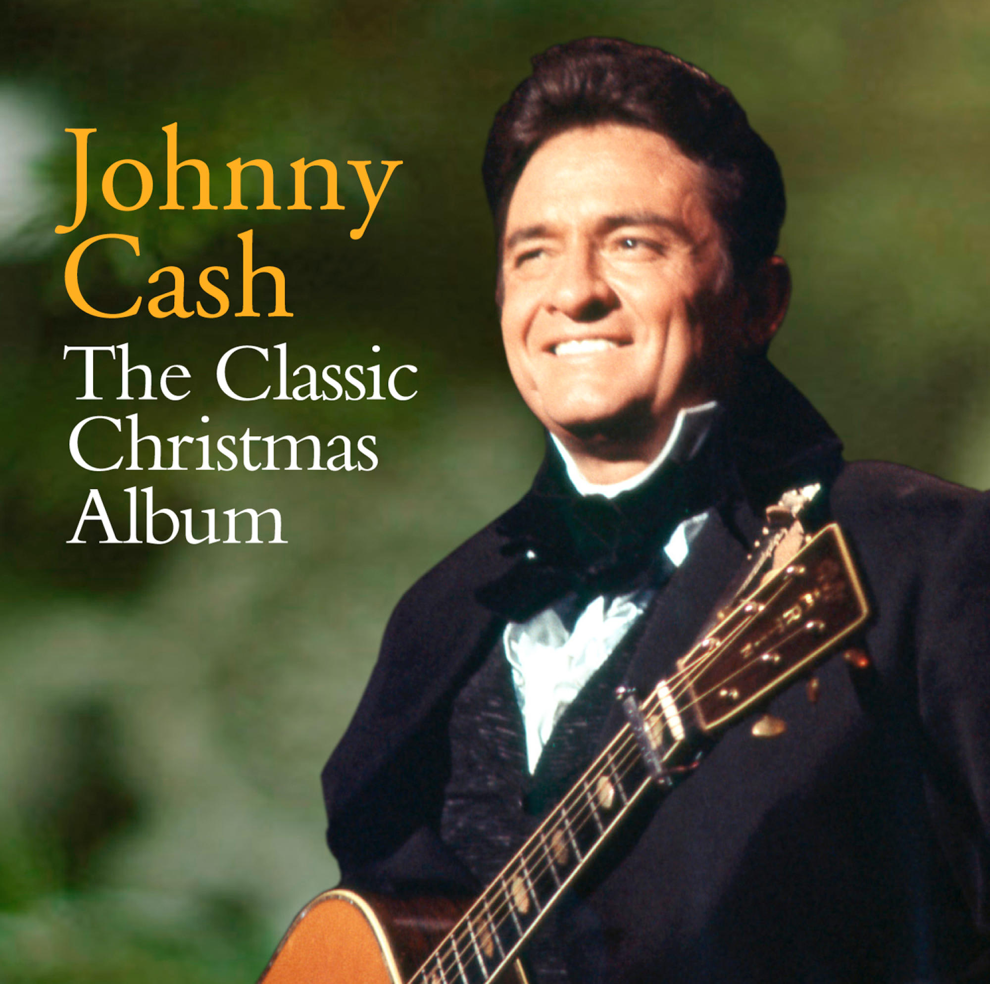 Albumcover mit Johnny Cash, der lächelt, Gitarre spielt und Text daneben.