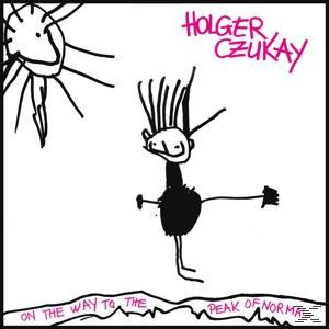 Albumcover mit Strichmännchen, Sonne und Text 'Holger Czukay' und 'On the Way to the Peak of Normal'.