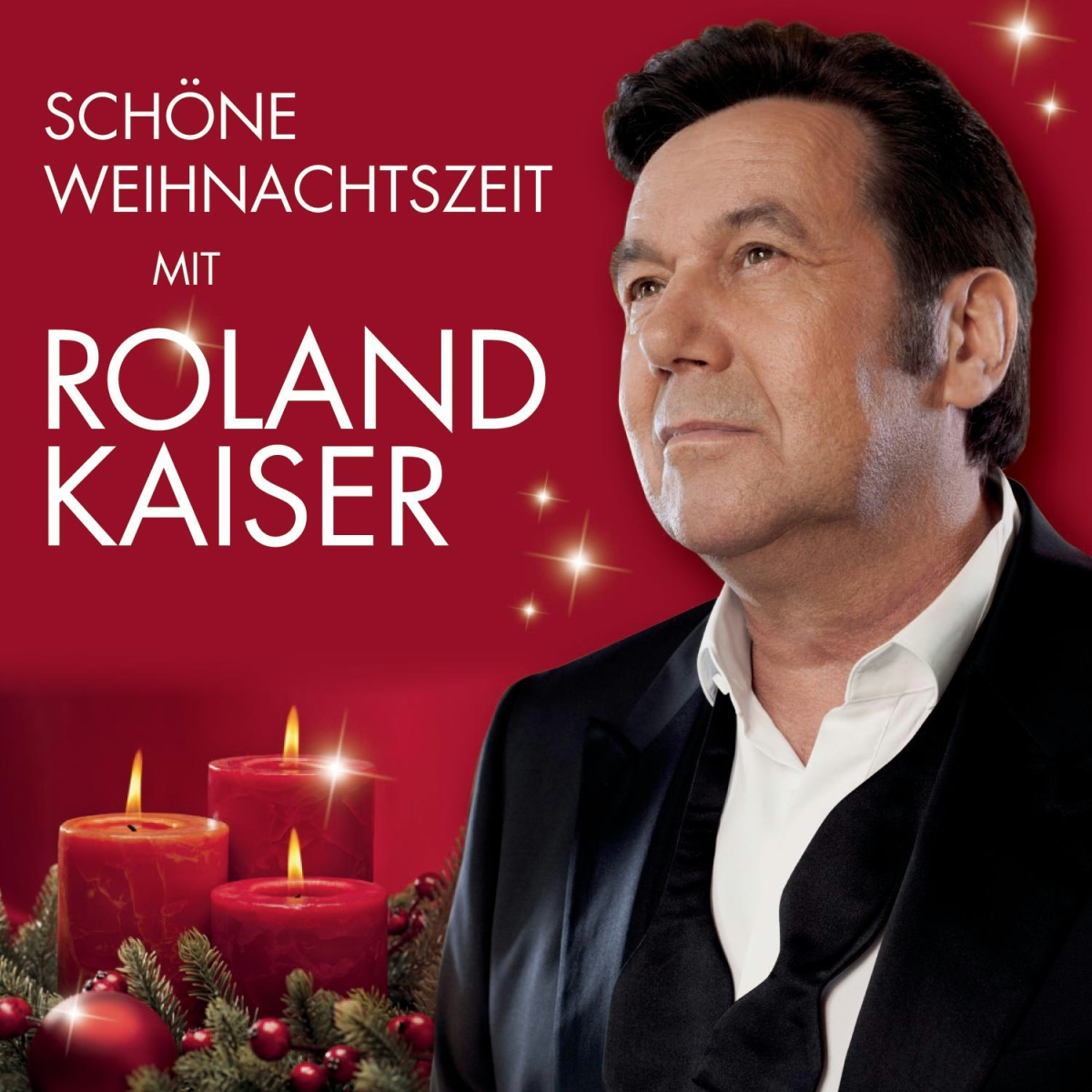 Albumcover. Ein Mann im Anzug, mit Text 'Schöne Weihnachtszeit mit Roland Kaiser' und Kerzen.