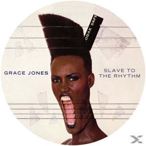 Grace Jones Albumcover: großer offener Mund, hoher Afro, Titel 'Slave to the Rhythm', weißer Kreis-Hintergrund.