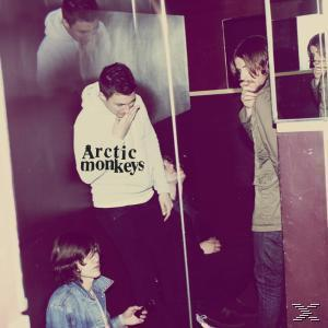 Az Arctic Monkeys album borítója. A zenekar tagjai tükörben láthatók, laza ruházatban. Sötét, komor tónusok.