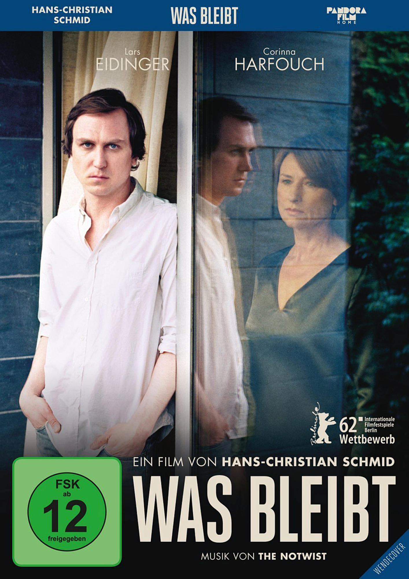 DVD-Cover. Ein Mann und eine Frau, einer schaut aus einem Fenster. Text überlagert: Was Bleibt.