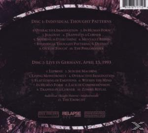 Album-Rückseite mit Text. Listen mit Songtiteln auf den Discs 1 und 2. Lila Hintergrund.