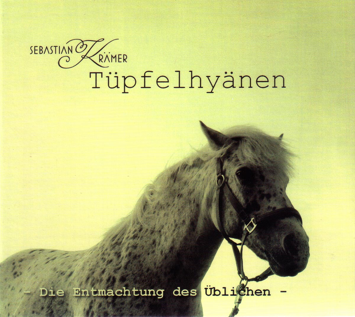Albumcover mit Pferdekopf. Text: 'Tüpfelhyänen' und 'Die Entmachtung des Üblichen'.