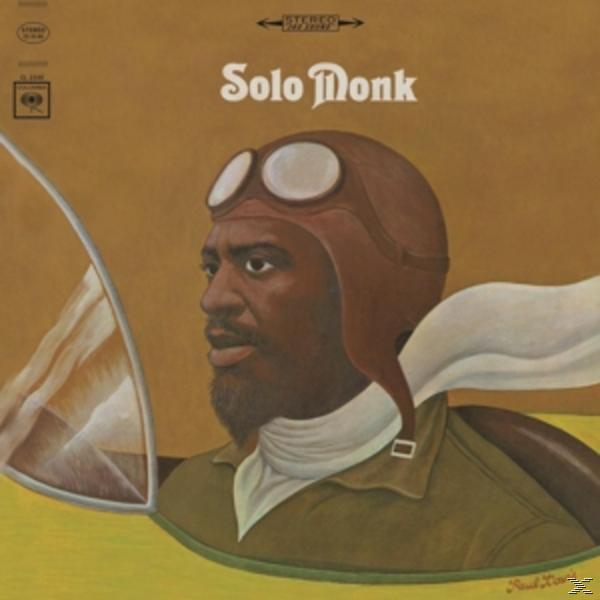 A 'Solo Monk' album borítója, egy férfival, bőr pilótasapkában. Sárga háttér szöveggel.