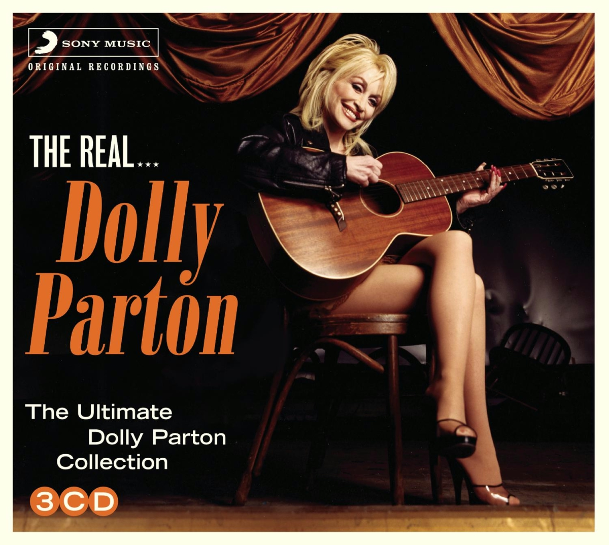 Albumcover von Dolly Parton, die Gitarre spielt, mit dem Text 'The Real Dolly Parton'.
