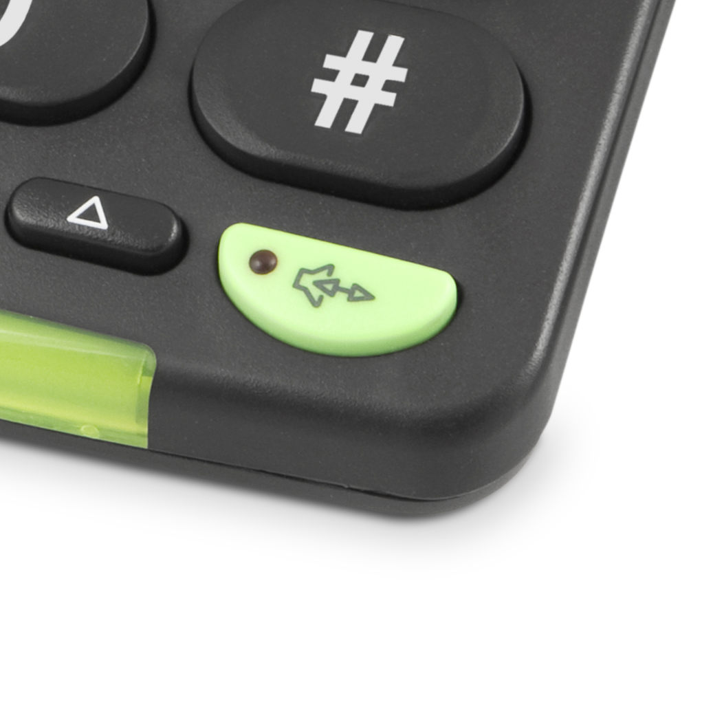 Nahaufnahme einer Telefontastatur. Eine grüne Taste mit einem Lautsprechersymbol ist sichtbar.