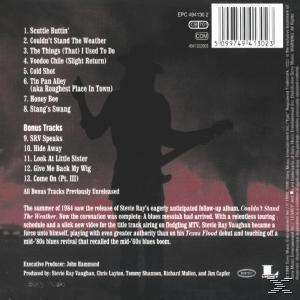 CD-Rückseite mit Songtiteln und Künstlerinformationen, mit einer Gitarristen-Silhouette.