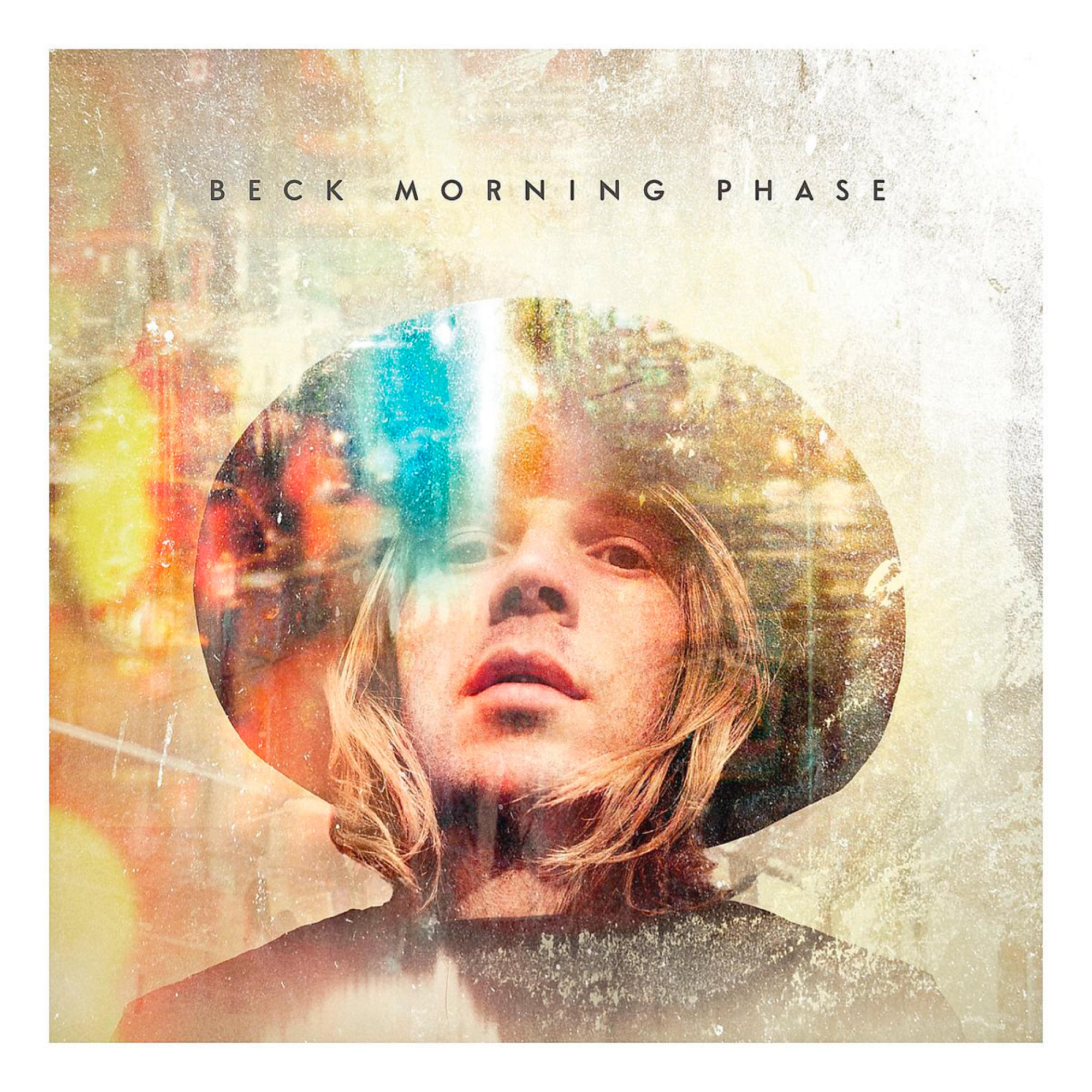 Pochette d'album avec le visage d'un homme portant un chapeau, avec les mots 'BECK MORNING PHASE' au-dessus.