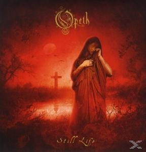 Albumcover: Eine Person in roter Kleidung steht auf einem Feld mit einem Kreuz. Rötliche Farbtöne dominieren.