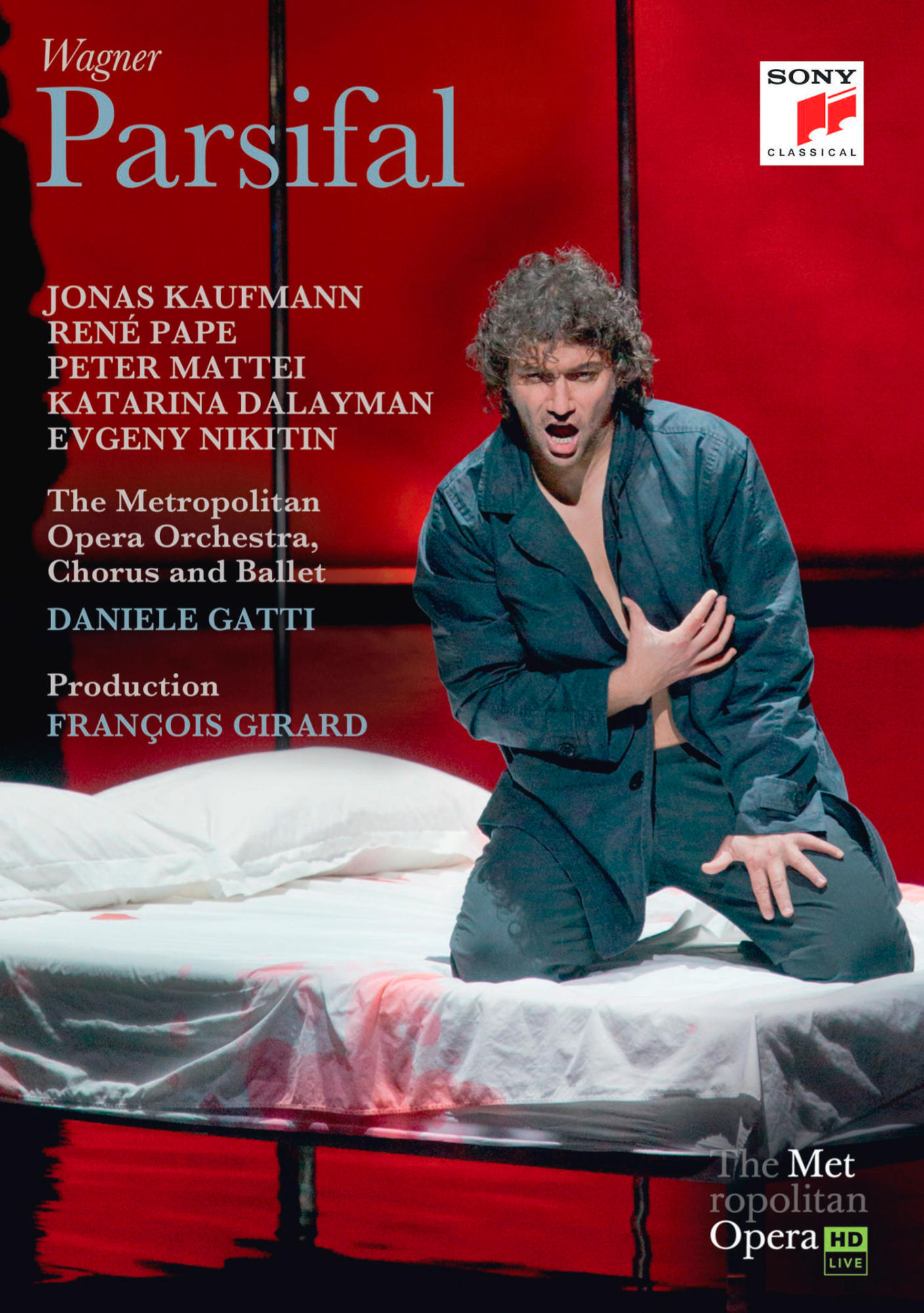 Operncover mit einem Mann in blauem Hemd auf einem Bett. Text: Wagner Parsifal.