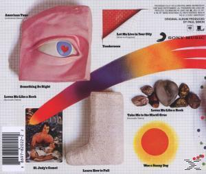 Albumcover-Kunst mit Auge, Socke und anderen abstrakten Formen und Objekten mit einem rot-gelben Farbverlauf.