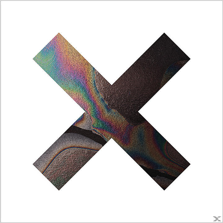 Ein X-förmiges Logo mit einem regenbogenfarbenen Muster auf weißem Hintergrund.