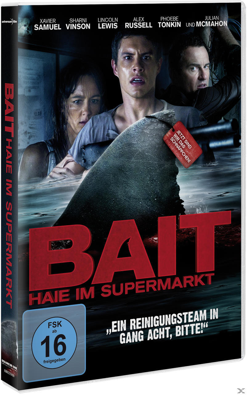 Filmplakat: Eine Haifischflosse im Wasser mit drei verängstigten Personen. Titel 'BAIT' in großen roten Buchstaben.
