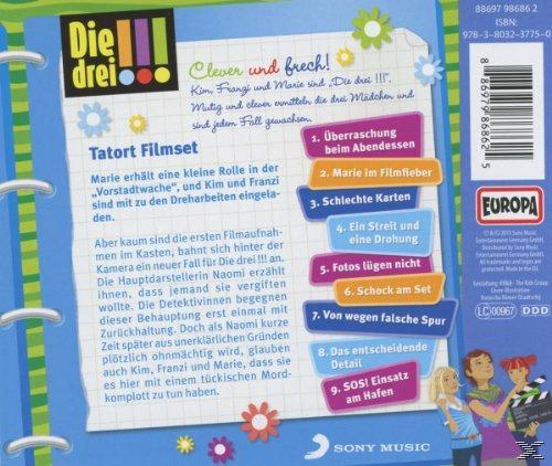 Rückseite eines CD-Covers mit Text und Grafiken. Drei Mädchen halten eine Klappe.
