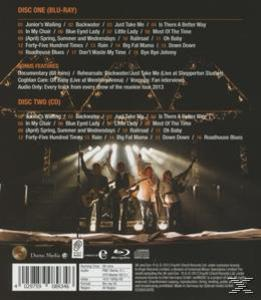 Rückseite eines Blu-ray/CD-Gehäuses, Bühne mit Musikern. Text listet Songs auf.