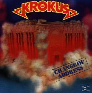 Albumcover mit dem Wort 'Krokus' oben und einem brennenden Gebäude. 'Change of Address' unten.