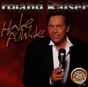 Mann mit Mikrofon auf CD-Cover. Das Albumcover hat rote und goldene Farben.