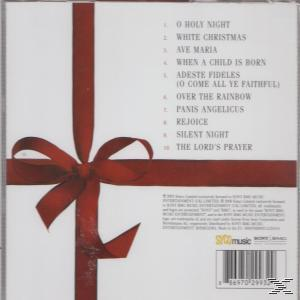 Das CD-Cover mit einem roten Band und einer Schleife auf weißem Hintergrund. Es listet Weihnachtslieder auf.