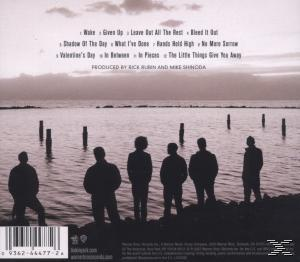 Album-Rückseite: Bandmitglieder-Silhouette am Strand, Trackliste und Produktionscredits.
