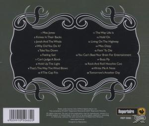 Albumcover mit Songtiteln, die in einem dekorativen Rahmen aufgeführt sind.