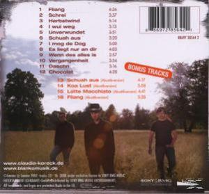 Rückseite einer CD-Hülle mit einer Gruppe von drei Männern, die auf einem Feld gehen. Trackliste wird angezeigt.
