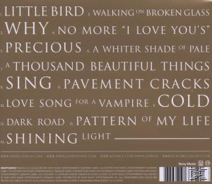 Albumcover mit goldenem Hintergrund und Songtiteln in weißem Text.