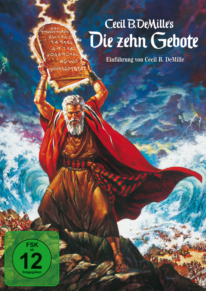 Filmposter: Moses hält Tafeln, Arme erhoben. Dramatischer Himmel und Meer im Hintergrund. Text: Die zehn Gebote.